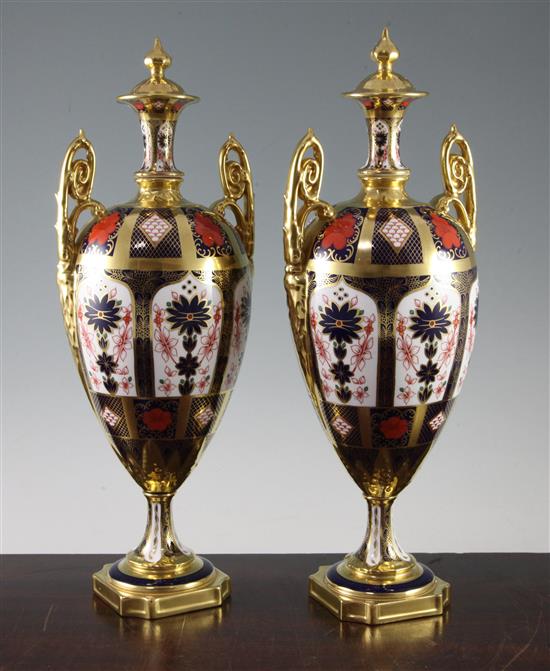 A pair of large Royal Crown Derby Imari pattern 1128 twin handled vases and covers, date code XLVII, 41cm